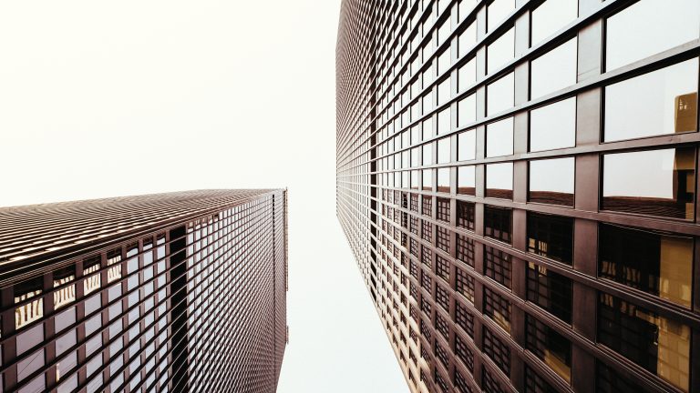 Upward shot of two glass buildings